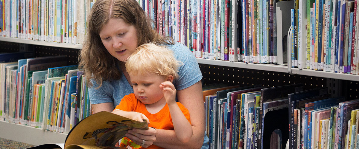 Woman reading with child