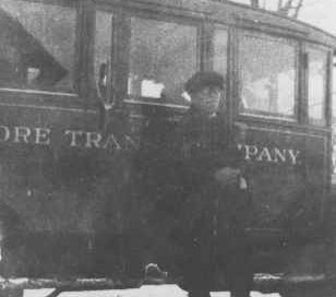 Bus and driver, "Baltimore Transit Company," served Prince Frederick - Baltimore.
