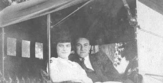 1930-1939 Couple (Madelyn Hutchins & James Harkness) sitting in an automobile