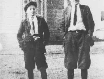 Two boys in front of Prince Frederick High School.